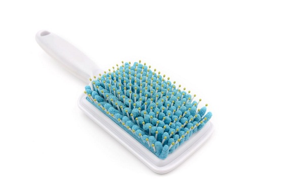 What is a scalp massage brush